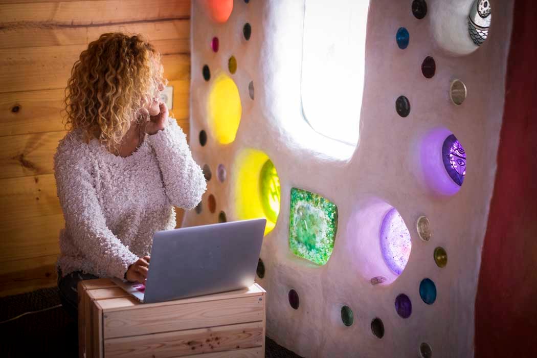 Alternative home or office workstation for young curly beautiful