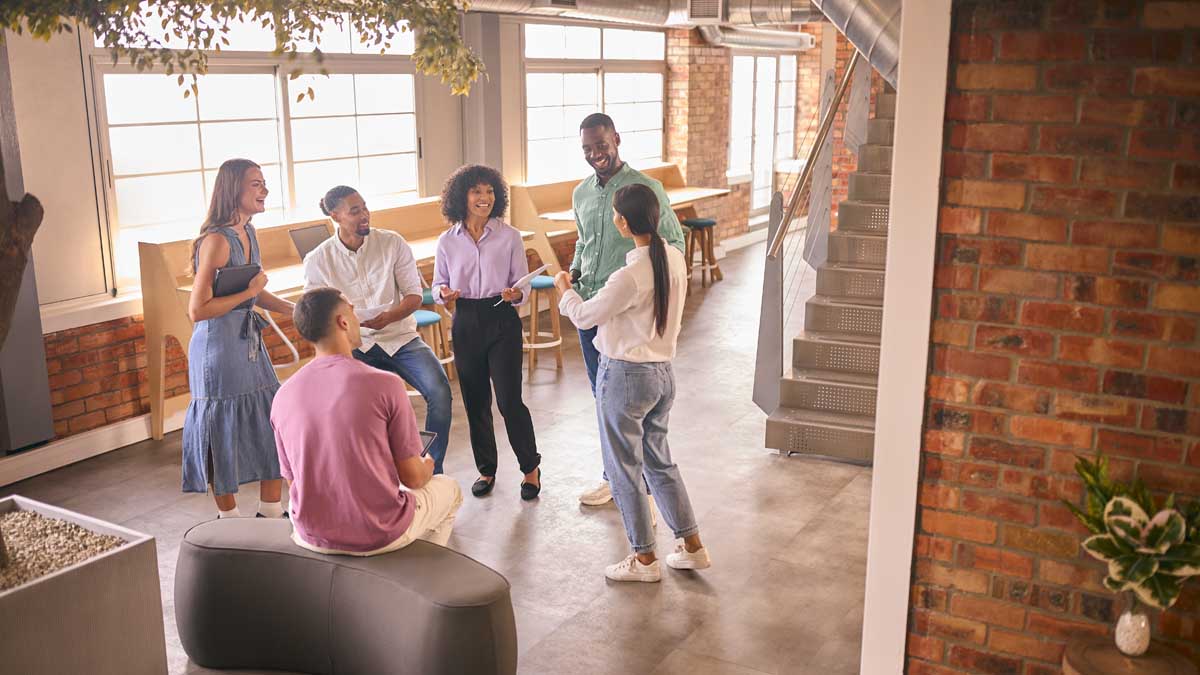 Multi-Cultural Business Team Having Informal Meeting Standing In