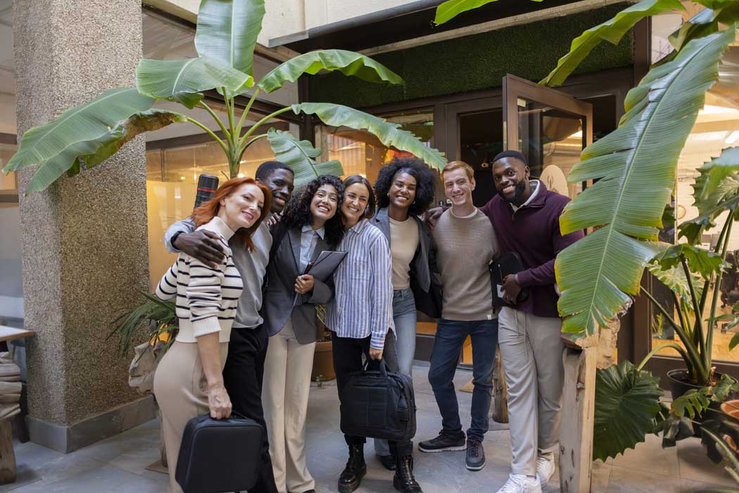 Multiracial business team smiling together in a coworking space